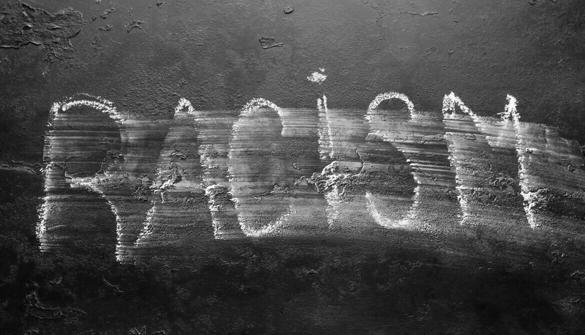 Chalkboard with the word racism partially erased