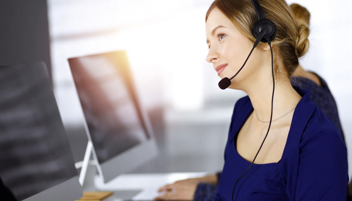 call center worker with headset and computer