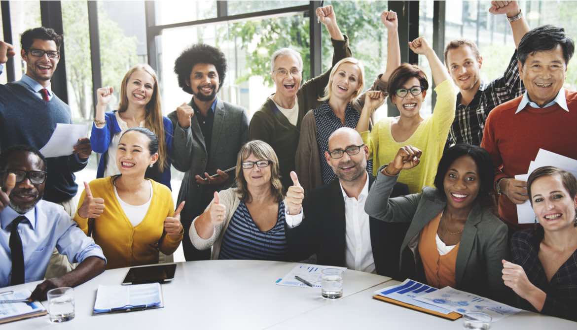 diverse team raising arms