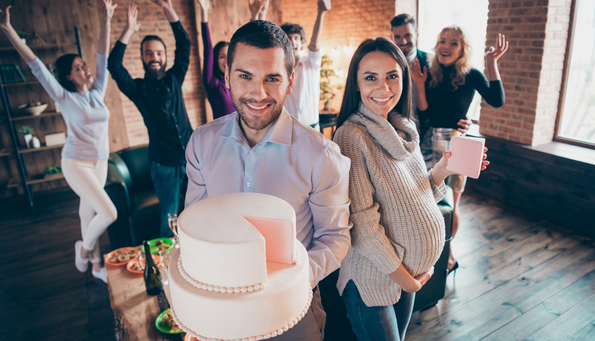 man with cake, pregnant woman with present, co-workers, office baby shower