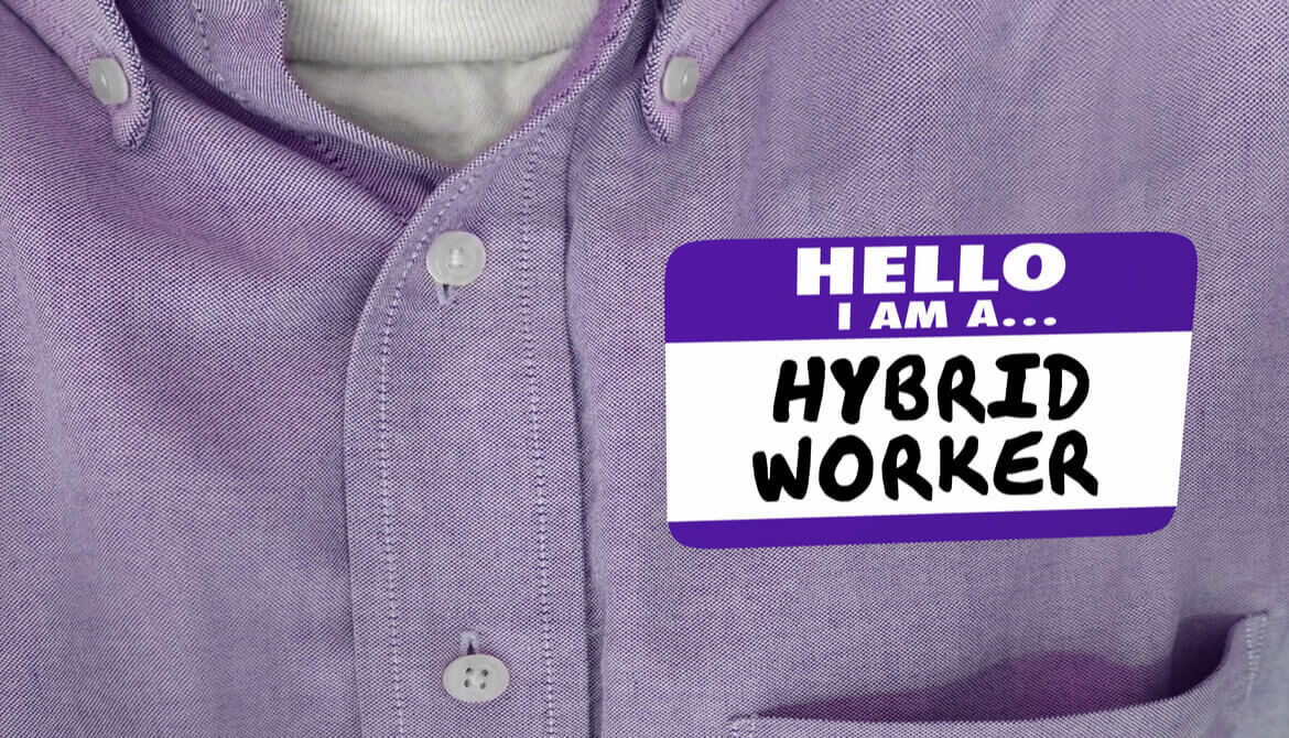 employee in purple shirt with hybrid worker name badge