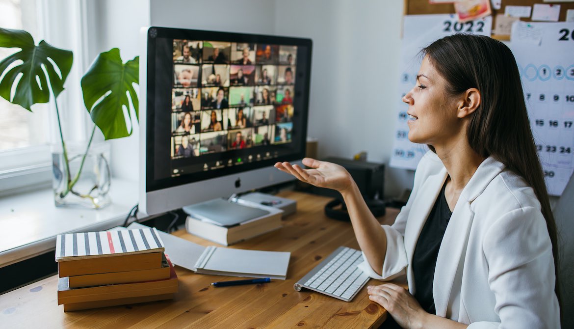 female leader managing employee talent remotely by video conference