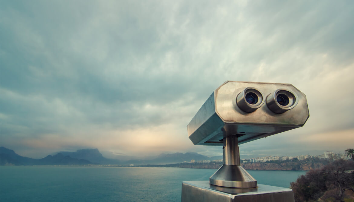 coin operated binocular viewer near a waterway