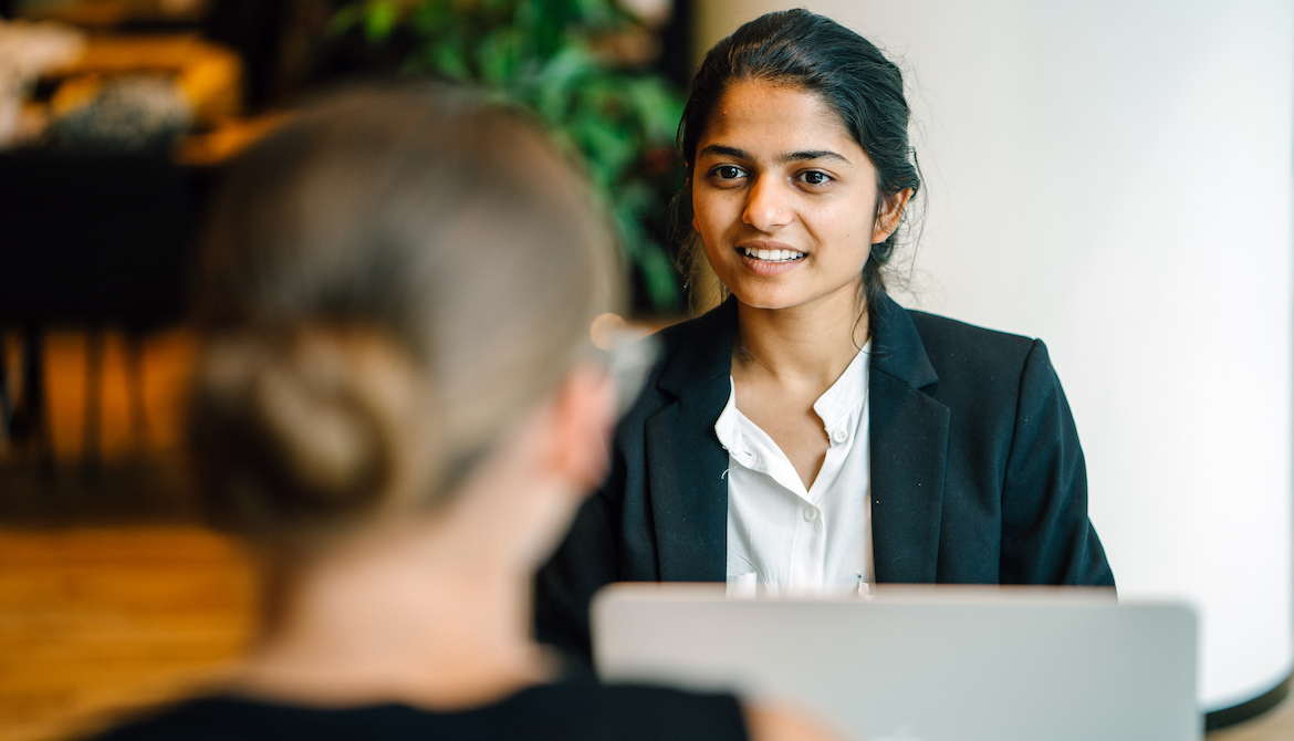 young female manager discusses performance review with female employee