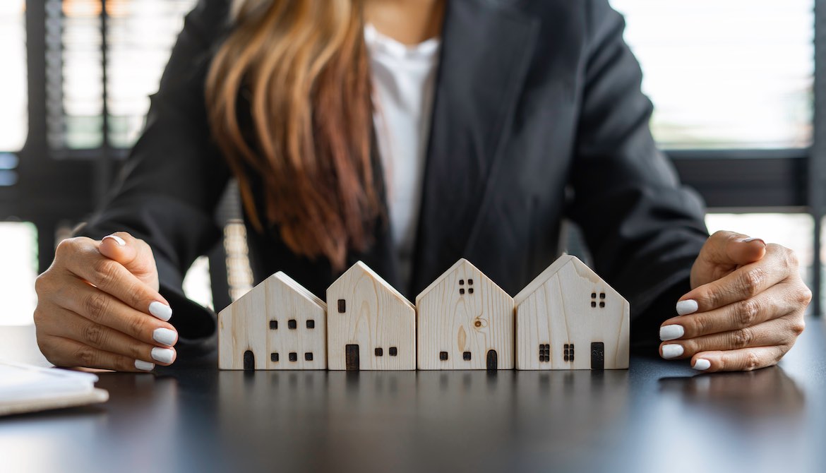 business woman houses of wood