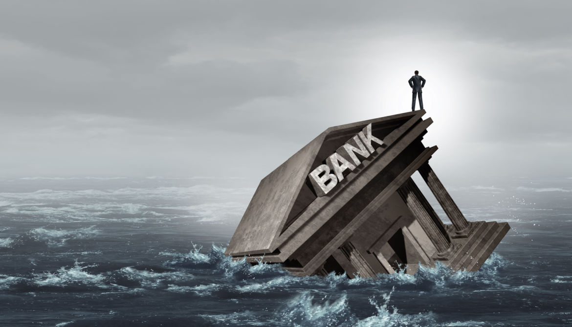 a bank drowns in a choppy sea of water 