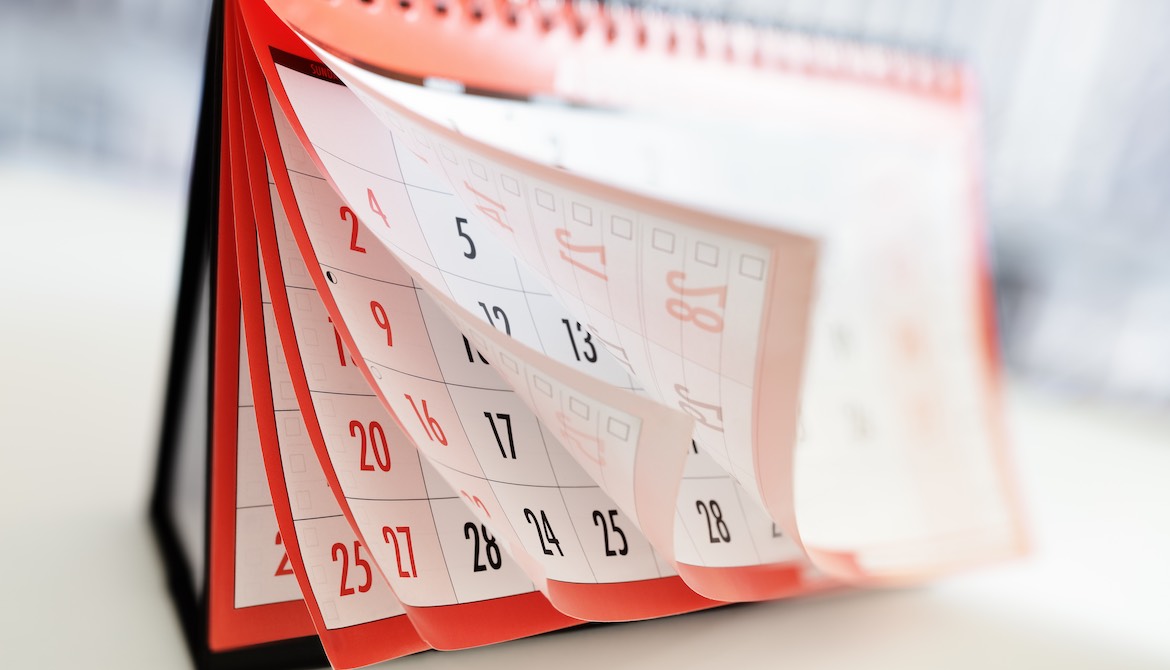 red-trimmed calendar with pages fluttering