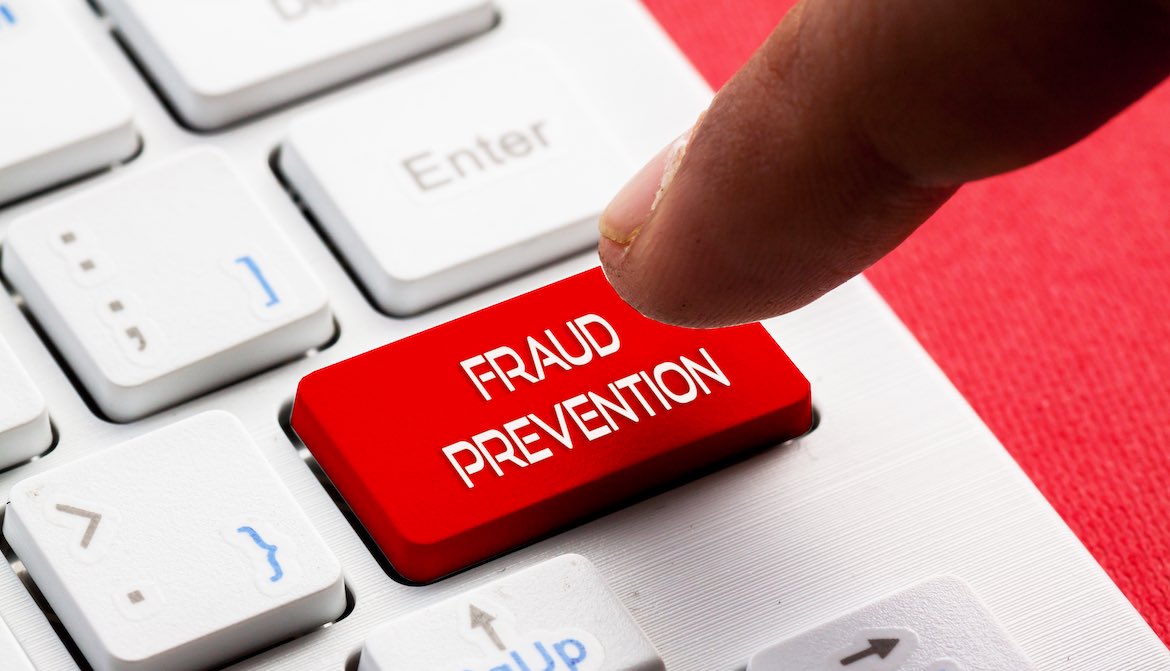 fraud prevention key keyboard finger