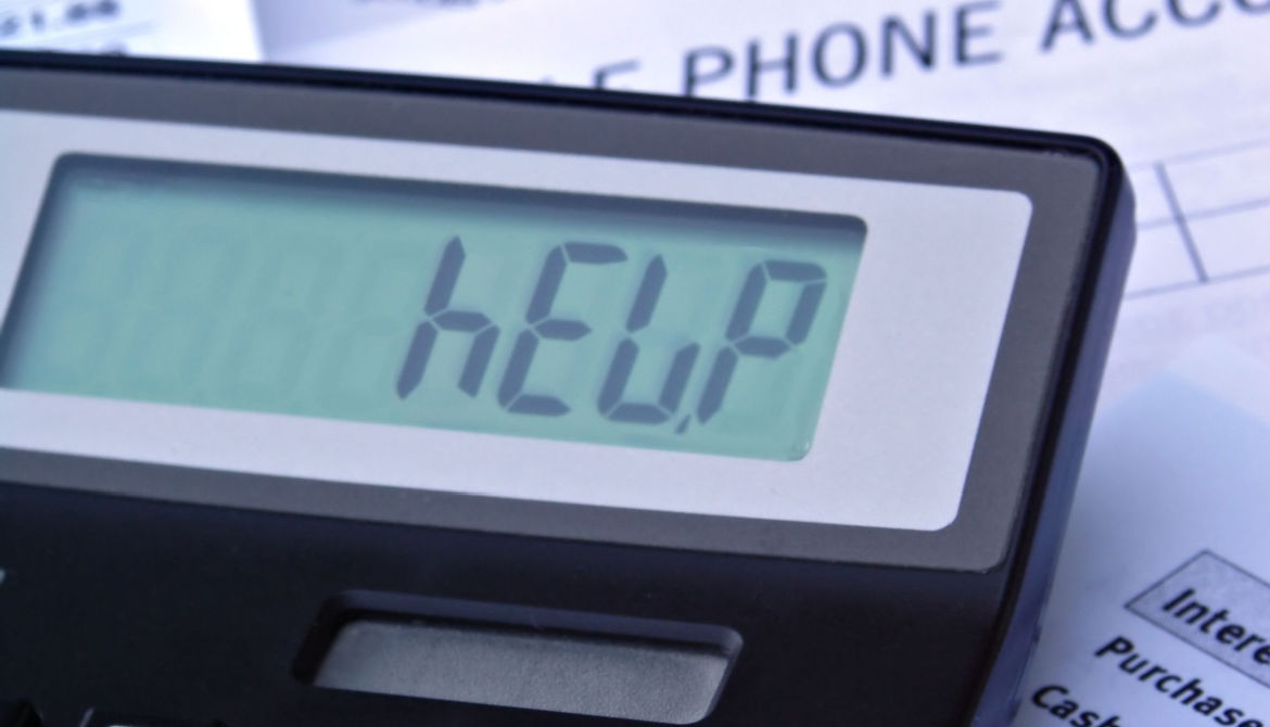 Bills and calculator displaying HELP
