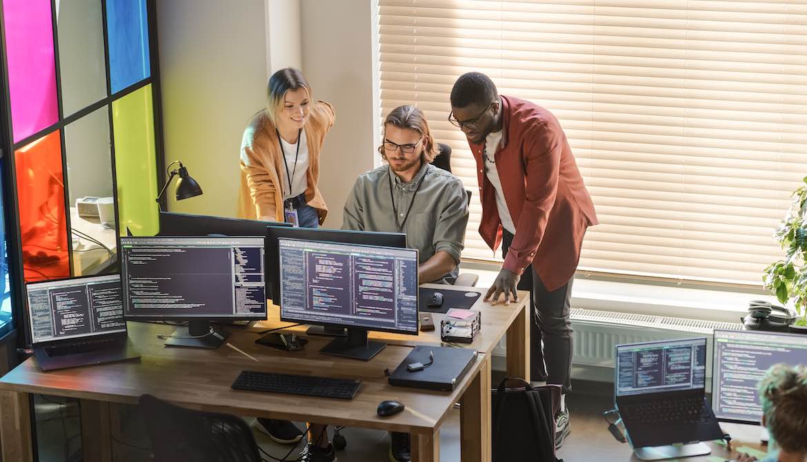 team monitors colorful window