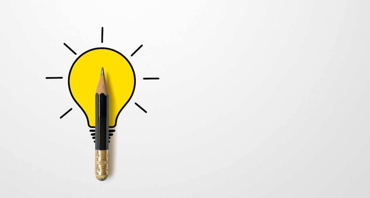 bright yellow light bulb pencil