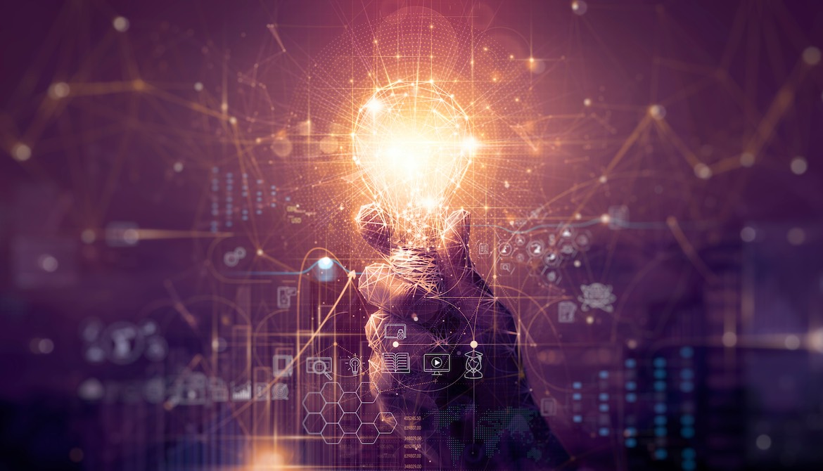 innovation leader holding illuminated lightbulb