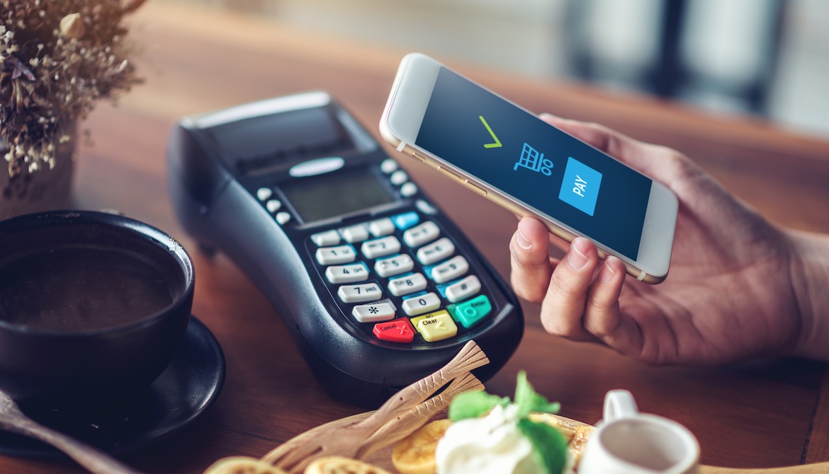 paying for meal at table using digital mobile wallet app