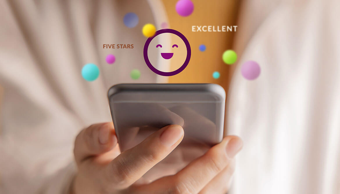 person using smartphone projecting happy face and positive reactions