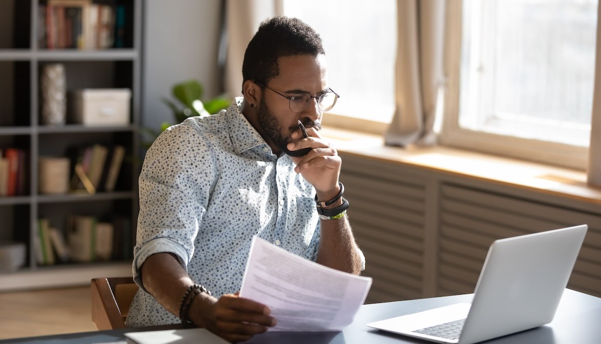 thoughtful manager working with laptop