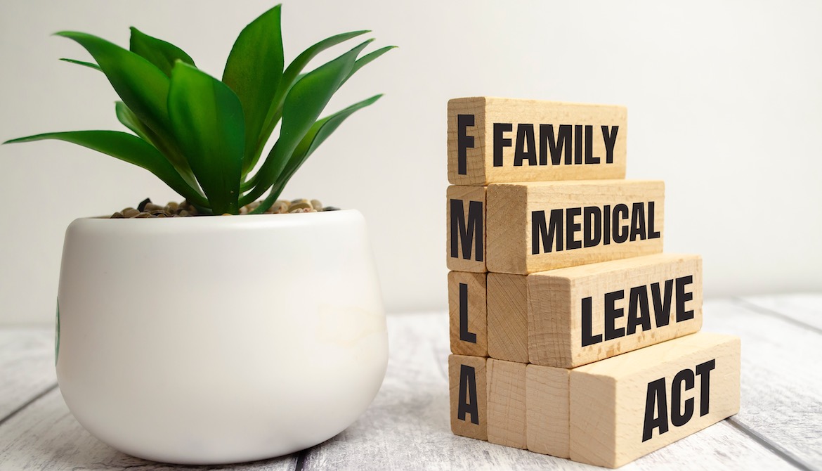 FMLA wooden blocks that read Family medical Leave Act