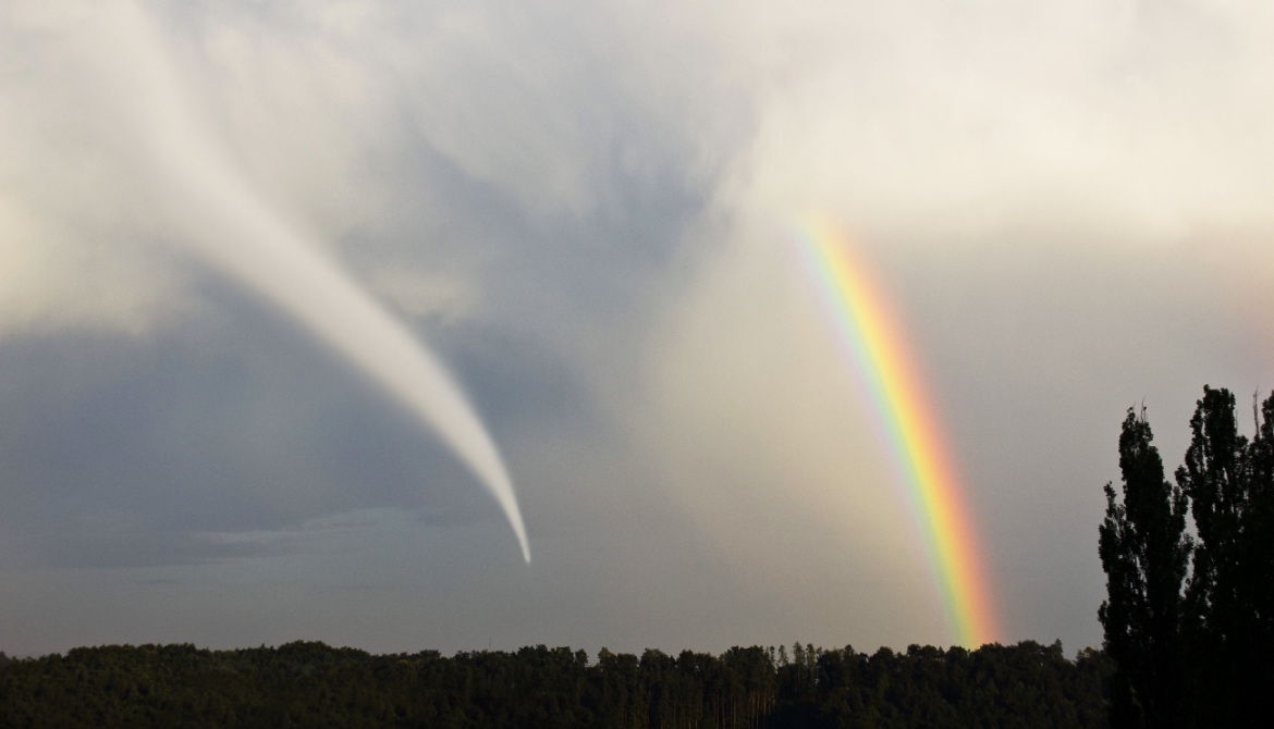 landscape with a tornado and rainbow