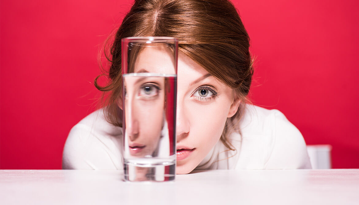 woman looking drinking glass