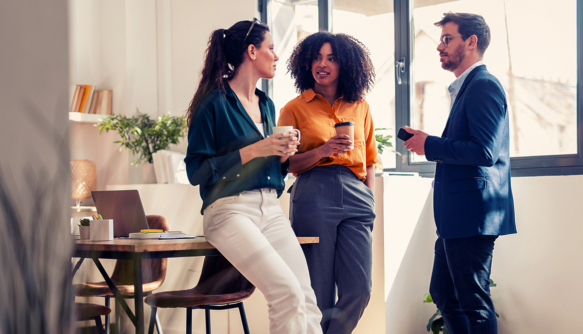 3 individuals standing around talking
