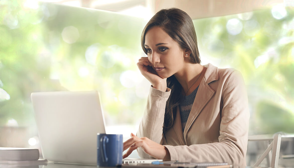woman looking at laptop