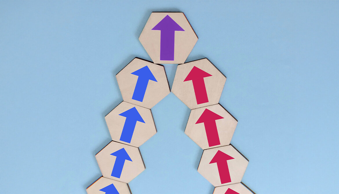 arrow blocks pointing up. blue on left, red on right come together as purple at the top