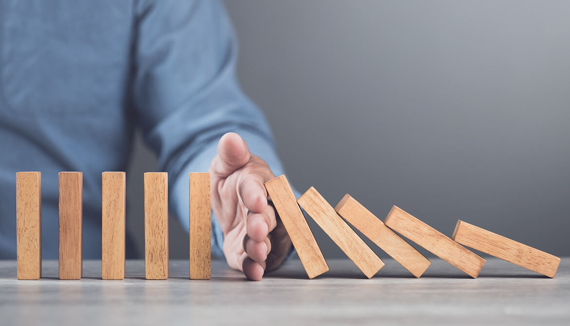 hand stops wooden dominoes