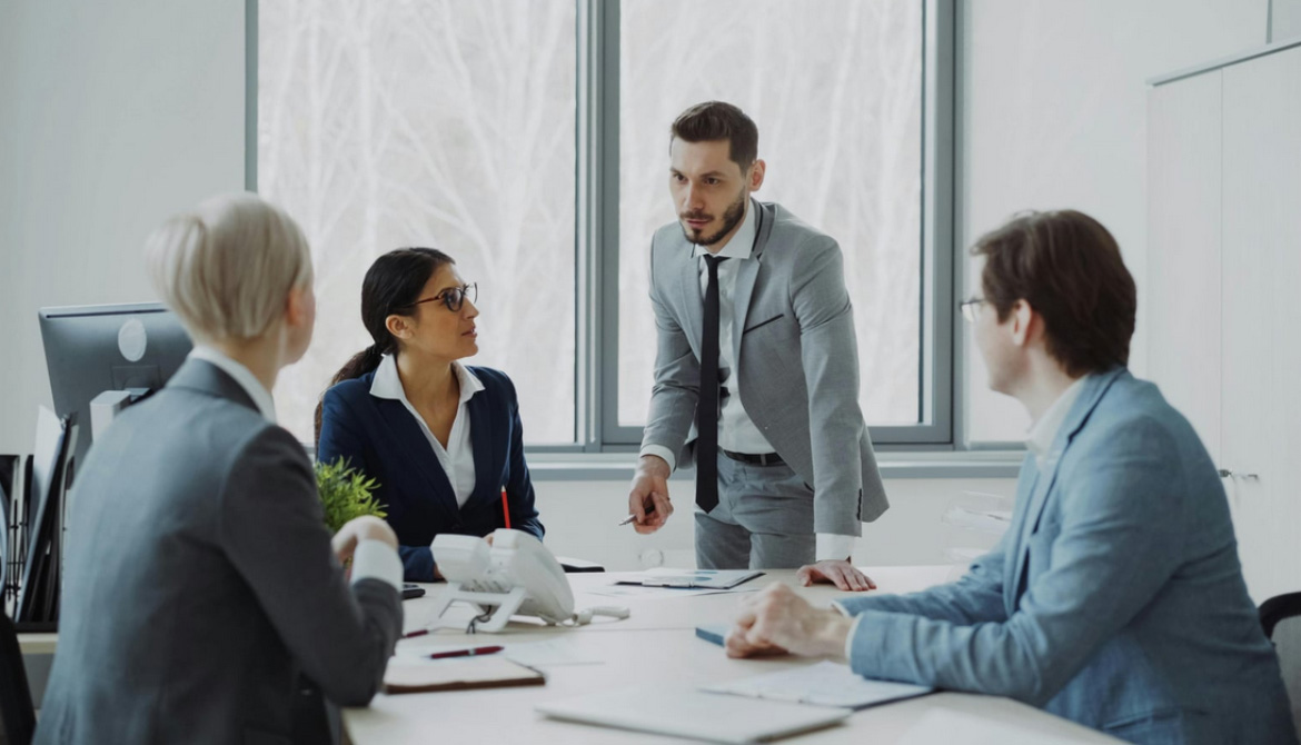 standing around table talking