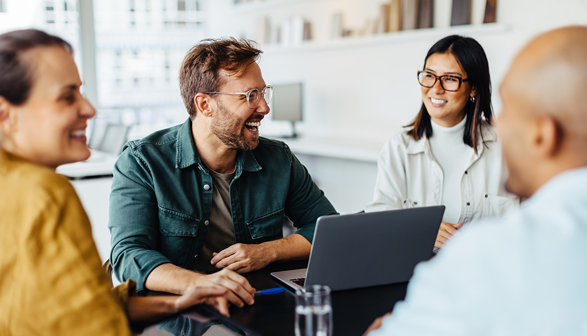 coworkers laughing while working together
