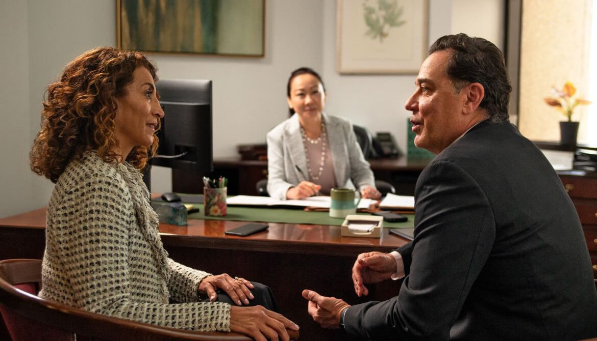 couple sitting at desk talking