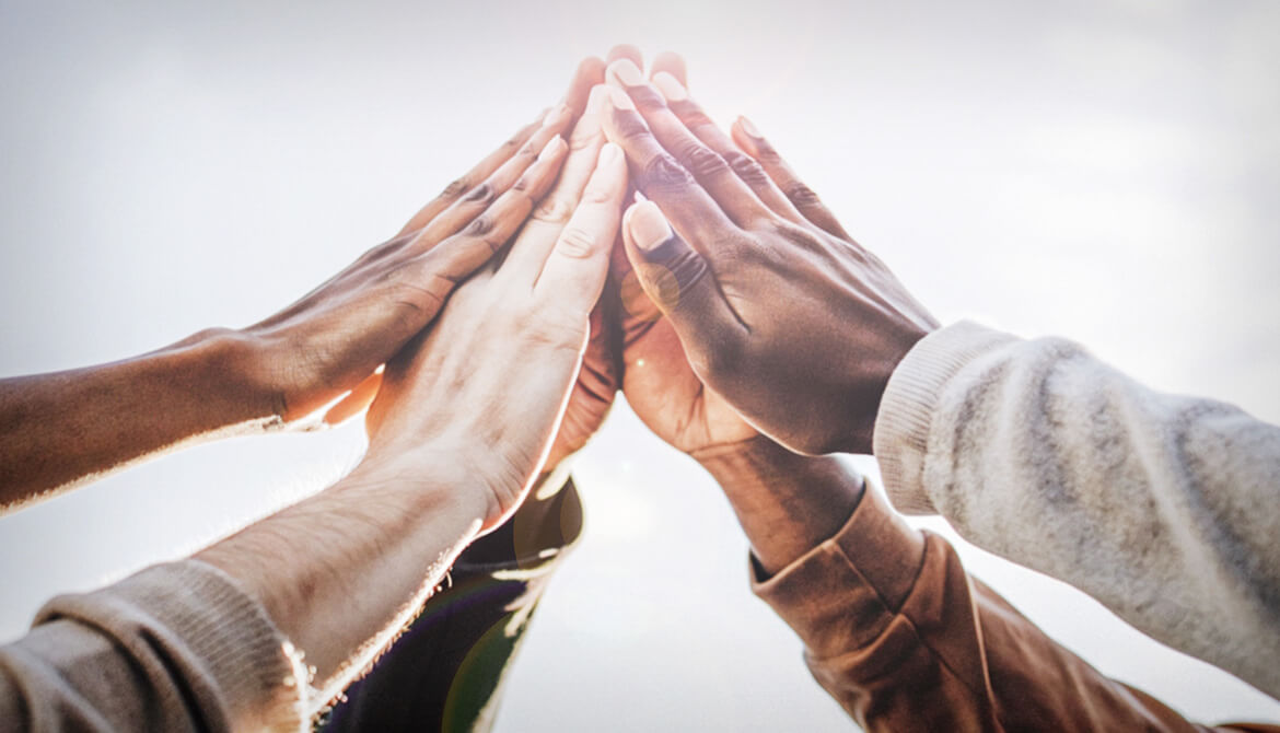 hand come together in center of image