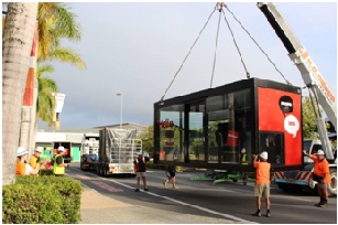 pop-up branch trailer being lowered by crane