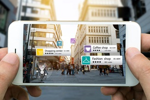 Person using an augmented reality AR app to view business reviews overlayed on the city around him