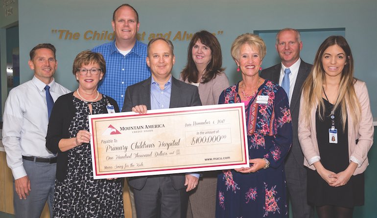Sterling Nielsen of Mountain America Credit Union presents check to Primary Childrens Hospital