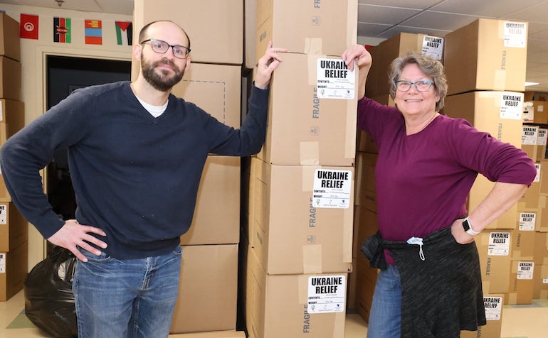 volunteers with boxes of supplies for Ukraine