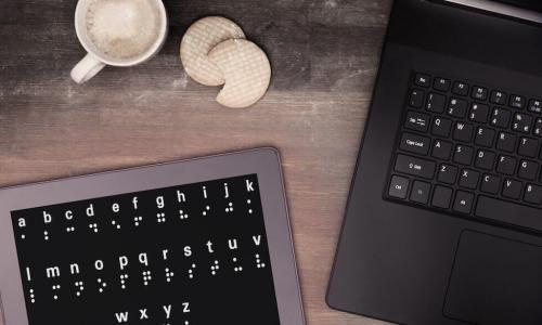 tablet and laptop on desk