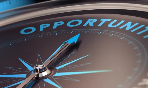 Compass with needle pointing the word opportunity