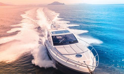 speed boat cruising through blue water at high speed