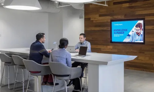 CU Direct regularly hosts CU and industry leaders at its Innovation Lab to collaborate on mapping and developing new solutions that improve lending and member engagement. CU Direct SVP/Marketing and Innovation Brian Hendricks (facing camera) meets with two other members of the CU Direct team.