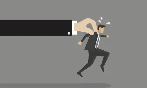 big hand signifying talent hoarding reaching out and pulling back a running business man