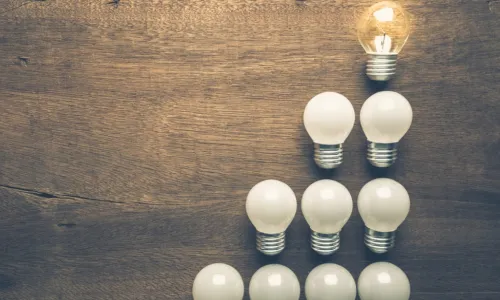 Different light bulb glowing on the top of the level