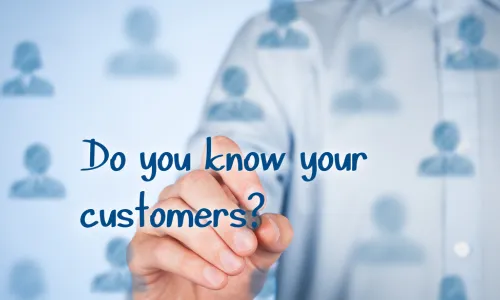 business man writing Do you know your customer on a glass wall