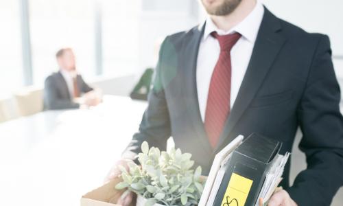 fired man leaving office with box