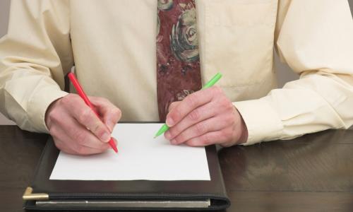 Ambidextrous Businessman working with both hands