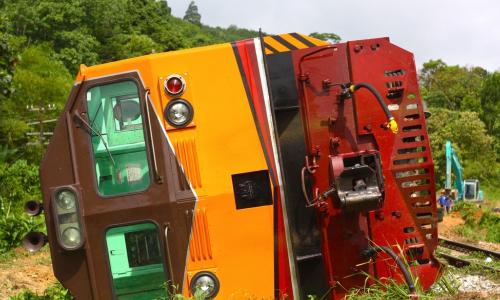 train car derailed and laying on its side