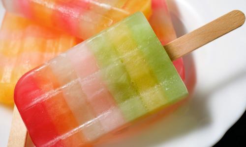 colorful popsicles on a white plate