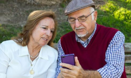 senior couple with smart phone