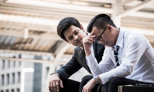 business manager reassures frustrated and upset employee