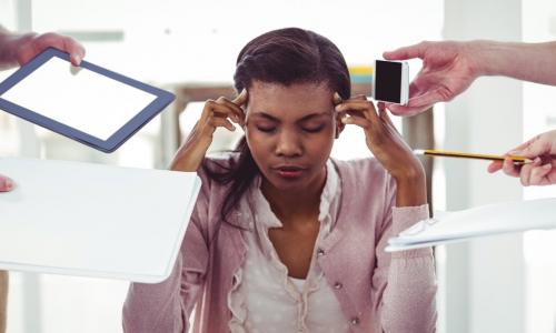 stressed businesswoman not being product due to too many interruptions