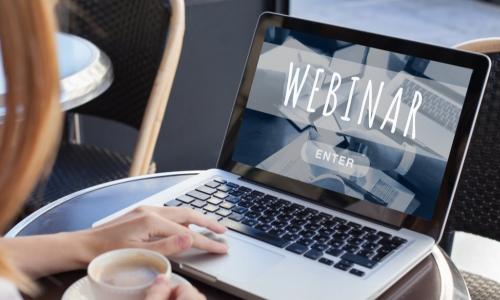 woman using laptop to view webinar