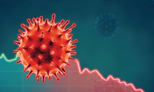 red coronavirus floating over graph representing the economy